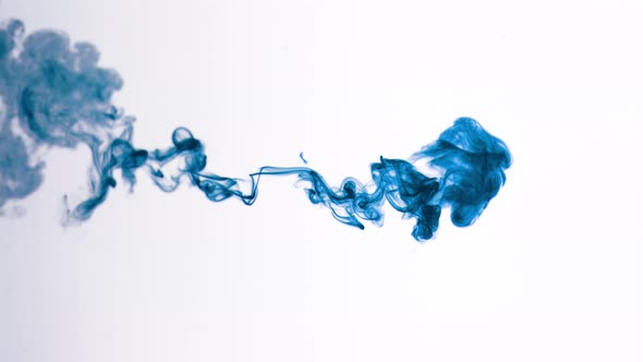 Isolated Blue Ink Cloud in Macro Slow Motion on White Background Framed for Vertical Video