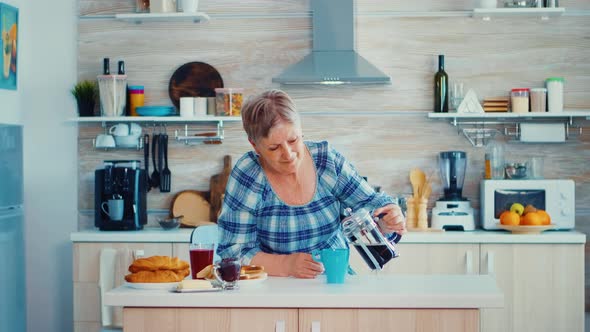 Pouring Coffe in Cup alt