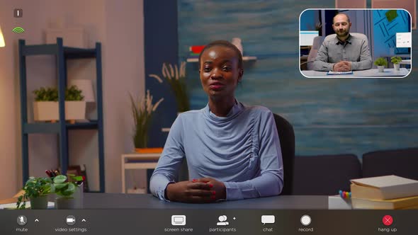 Black Business Woman Talking in Front of Camera Having Video Call alt