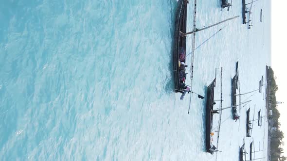 Tanzania Vertical Video  Boat Boats in the Ocean Near the Coast of Zanzibar Aerial View alt