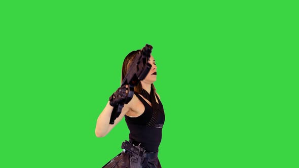 Animecharacter Girl in Military Clothes Walks with Machine Gun on a Green Screen Chroma Key