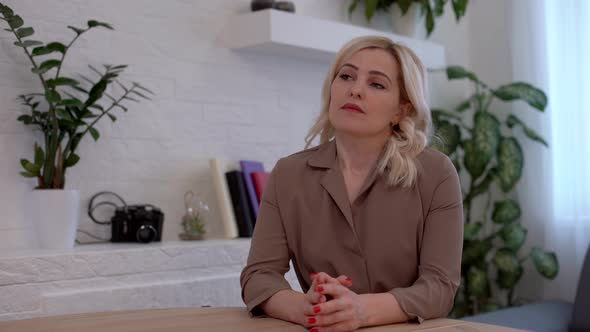 Bored Woman Looking Disappointed While Waiting at the Table alt