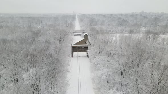 4k drone video of antique coal chute during winter in Lansing Michigan. alt