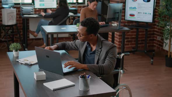 Portrait of Person with Disability Smiling at Camera at Preparing alt
