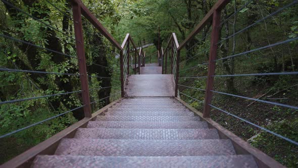 Going down the suspension metal stairs alt