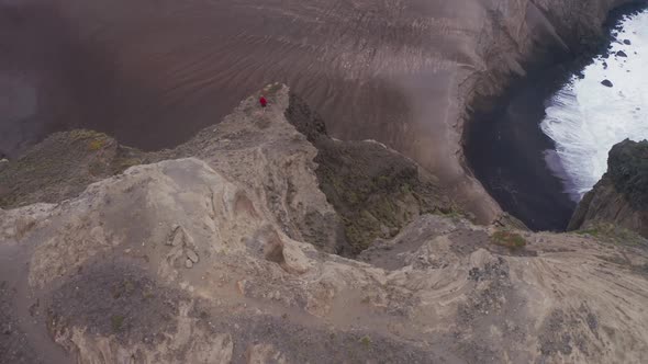 Guy Enjoying Ocean Landscape at Capelinhos Volcano Faial Island Azores alt
