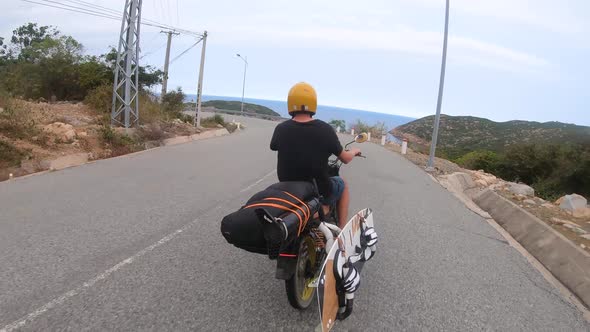 Motorcycle trip on Vietnam coastal scenic road in search of surfing adventure alt