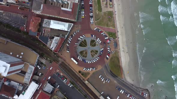 Birds eye drone shot of Muizenberg, Cape Town - drone is descending ...