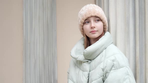 Portrait of Pensive Teenage Girl Looking Sideway in City alt