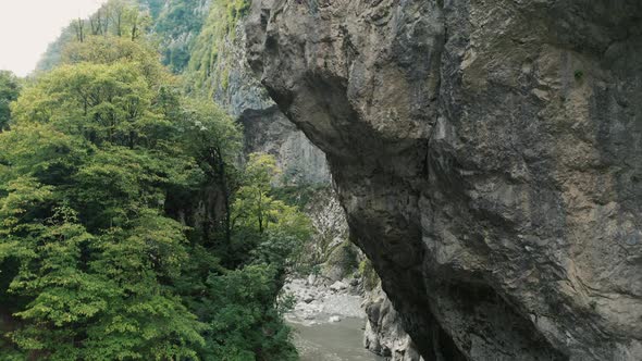 Aerial view; drone moving up over the river