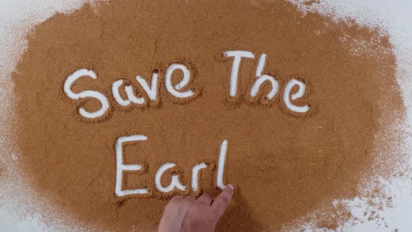 Hand Writes On Soil  Save The Earth alt