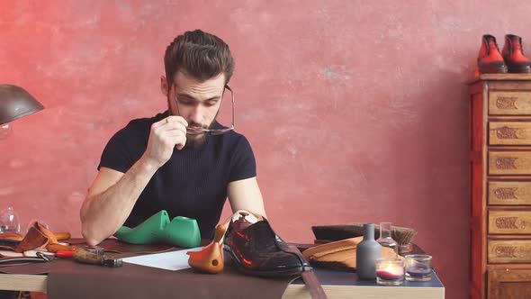 Serious Cobbler Engaging in Shoe Making Process