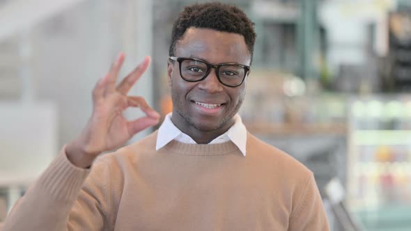 Positive Creative African Man Showing OK Sign alt