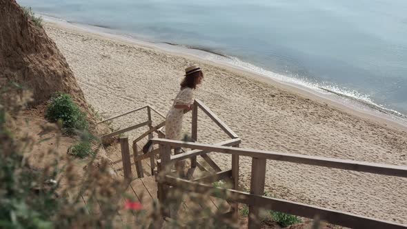 Active Girl Watching Seascape Standing Beach Ladder alt