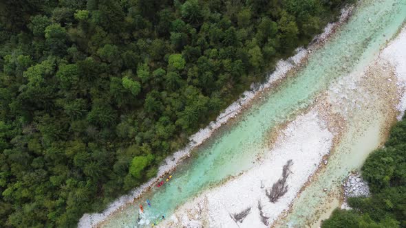 Aerial view of kayakers in the river Soca in Slovenia.