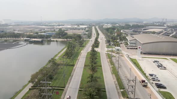 Aerial of Amata City Rayong Industrial Estate in Thailand 2 roads with traffic alt