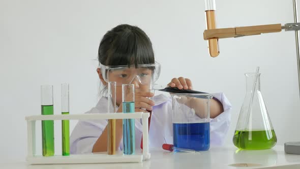 Children play and learn chemical in laboratory