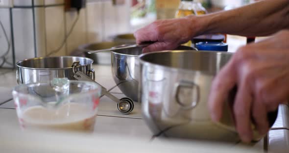 A woman chef preparing her dishes and ingredients for baking a vegan chocolate cake on a kitchen cou alt