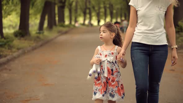 Mother's Day. Girl Holding Mother Hand.  Kid Enjoy Together With Family. Happy Children. alt