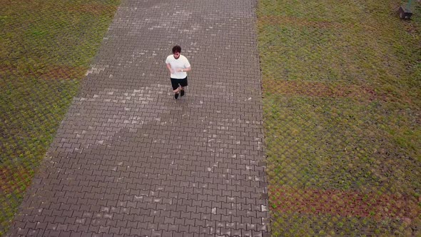 a Man Running a View From a Height alt