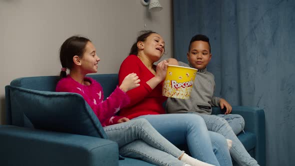 Multiethnic Family with Two Children Having Pastime Together at Home alt