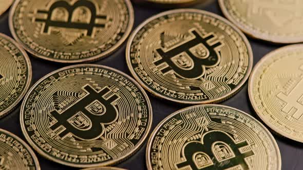 Bitcoin Coins on Black Background  Closeup Fullframe Spinning Background