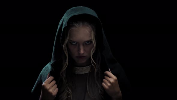 Young Blonde Lady Wearing a Black Hood on Her Head, Worried Look alt