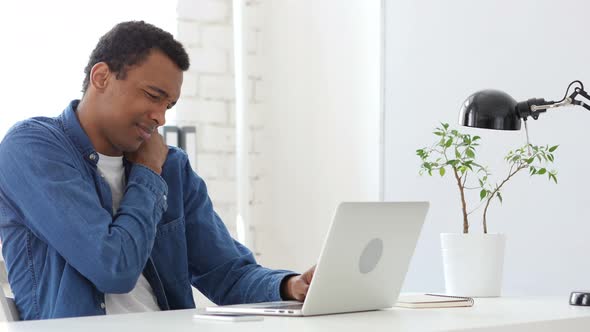Tired  Afro-American Man at Work, Trying to Relax alt