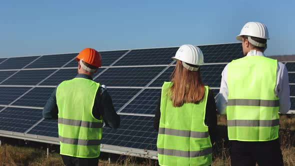An Engineer is Conducting a Tour of the Solar Panel Station alt
