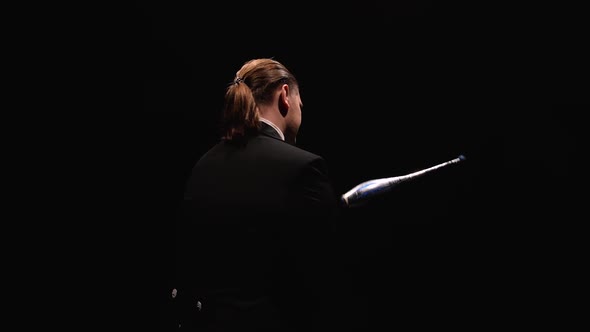 Camera Rotates Around Circus Juggler Using Pins To Juggle alt