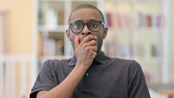 Portrait of Upset Young African Man Feeling Shocked alt