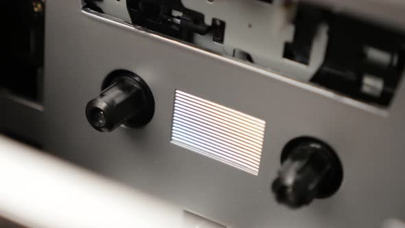 Slow pan on supply spindle rotates on music tape playing mechanism 3840X2160 UltraHD footage - Shall alt