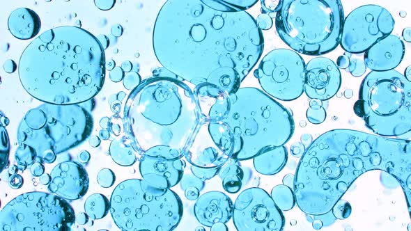 Super Slow Motion Shot of Moving Blue Bubbles Isolated on White Background at 1000Fps alt
