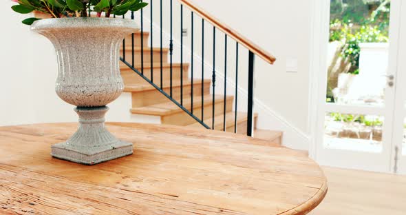 Son and father watching television in living room alt