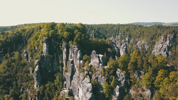 Aerial Footage of Saxon Switzerland Hilly National Park with Mountain Peak and Forest