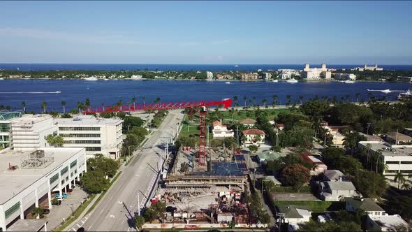 An awesome shot of a tower crane with the intracoastal and ocean in the background. alt