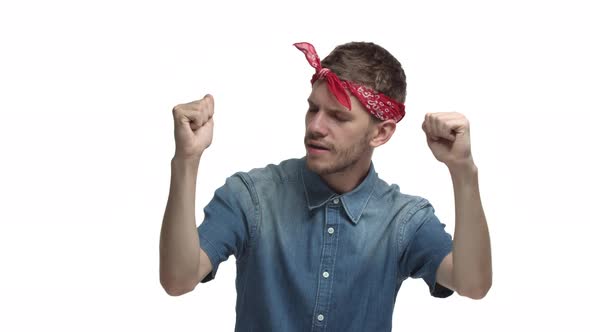 Video of Handsome Hipster Guy with Red Headband Over Forehead Dancing and Vibing Close Eyes and Move