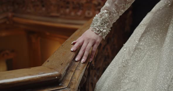 Gentle Hand Of The Bride In A Wedding Dress