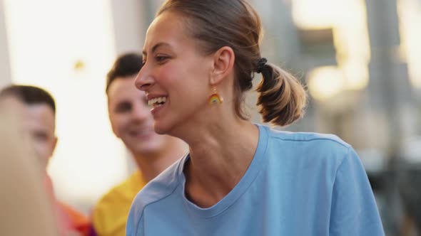 A pleased group of people waving rainbow flag for lgbt rights alt