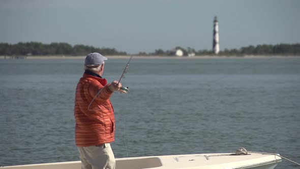 a man fly fishing at cape lookout alt