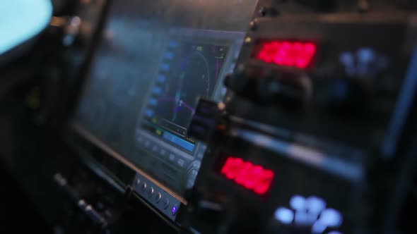 Pilot Hand Switching Buttons on Flight Panel of Airliner, Controlling Plane alt