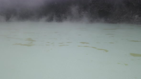 Aerial view fly through smoky in white crater, bandung, Indonesia alt