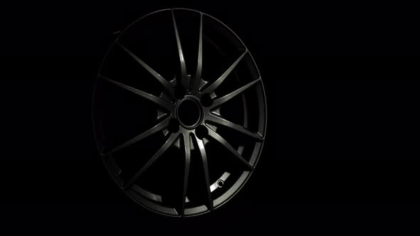 New Aluminium or Magnesium Alloy Wheel for Car in Dark Background alt