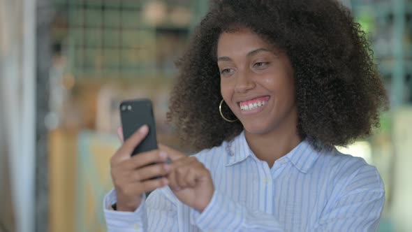 African Woman Using Smartphone  alt