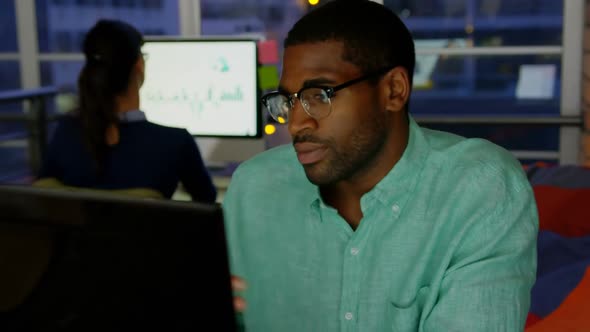 Businessman making video call on computer in a modern office 4k alt