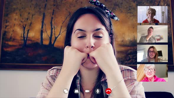 young  woman in video call by skype talking to distant relatives and friends alt