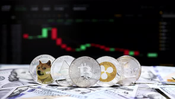 Coin Bitcoin, Ethereum, Litecoin, Shiba and Ripple on dollars on background cryptocurrency chart alt