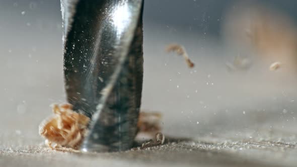 Super Slow Motion Detail Shot of Drilling Wood at 1000 Fps. alt