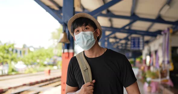 Man walking and looking a watch alt