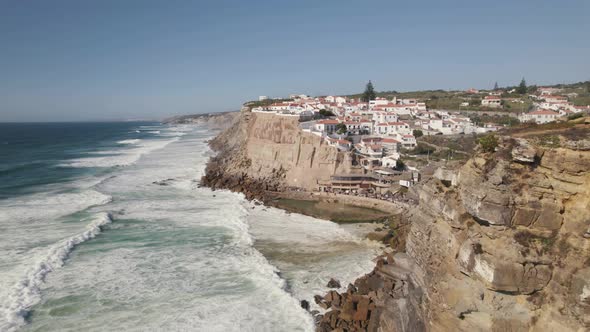 Strong waves washing on cliffs. Picturesque Azenhas do Mar town on Portugal Atlantic coast. alt